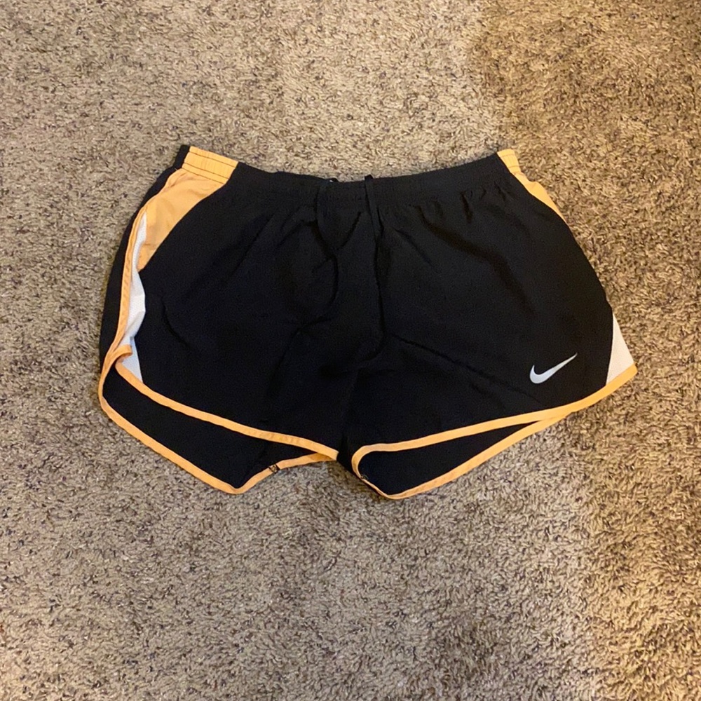 Black and orange Nike dri fit running shorts